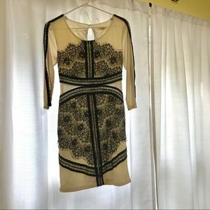 Cream and black lace dress with see through sides